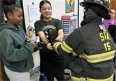 EMS volunteer with students
