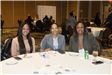A trio of women smiling at the WIMG Networking and Awards event