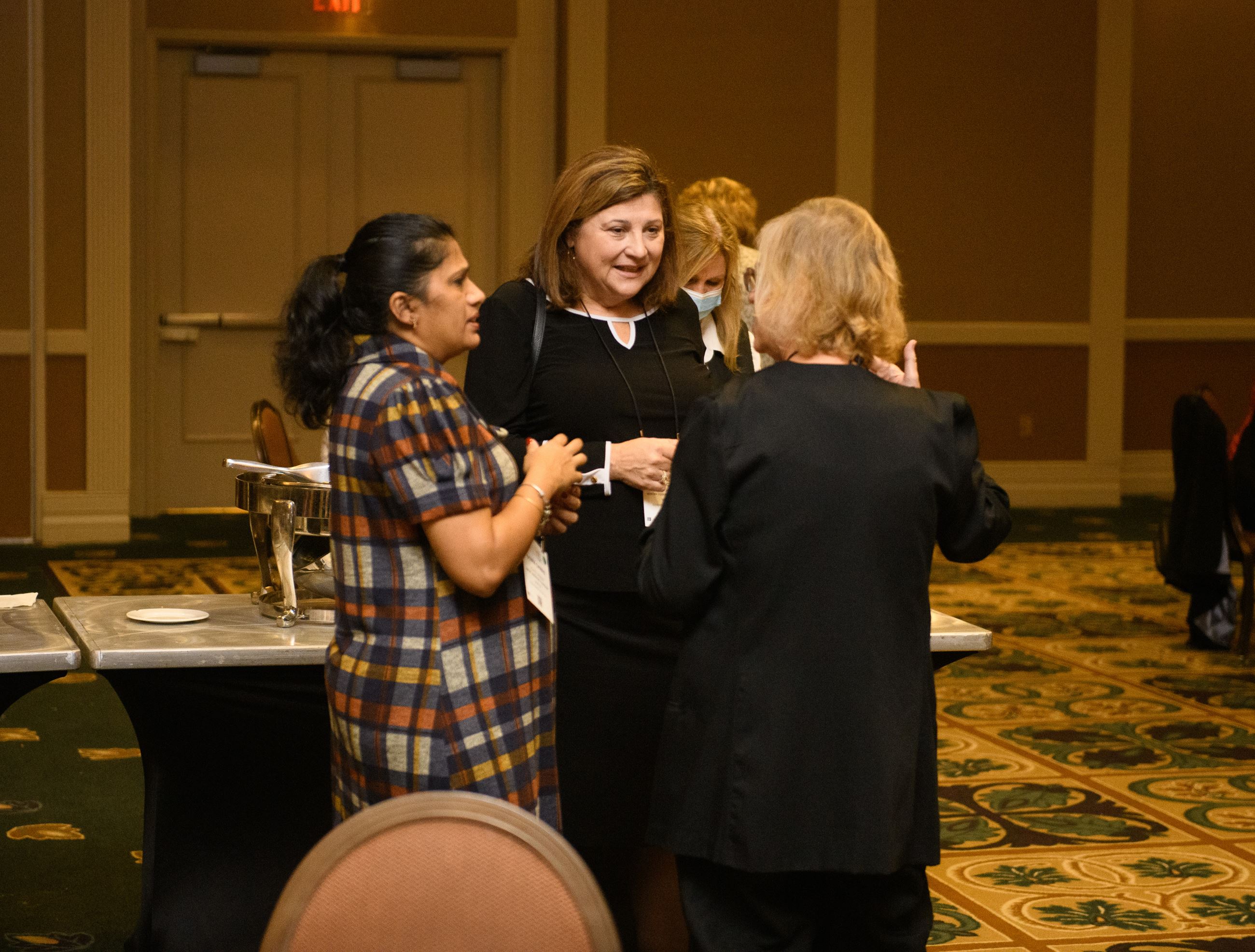 Guests mingle at the WIMG Networking Event