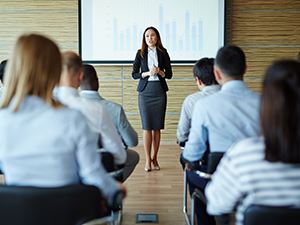 Businesswoman Speaking to Crowd