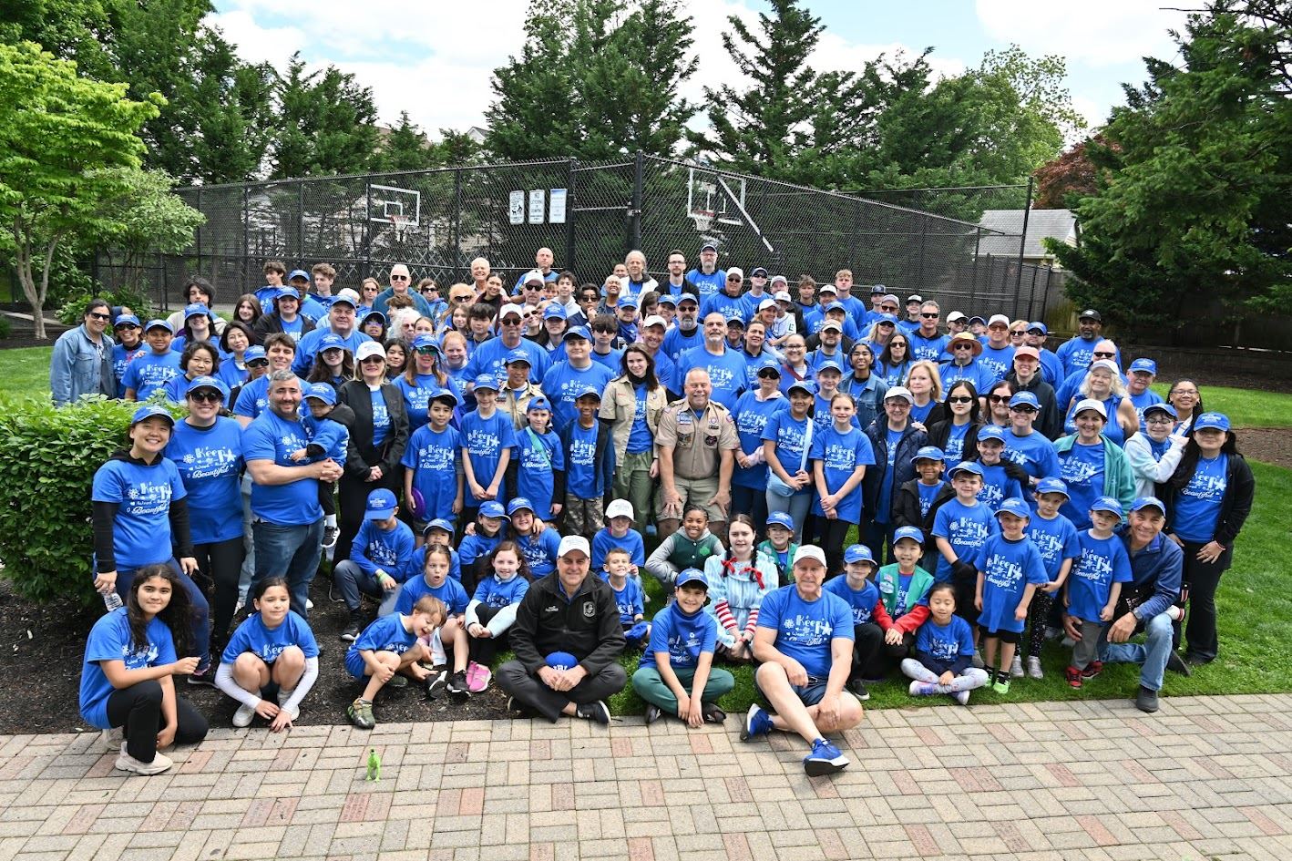 Keep Wood-Ridge Beautiful 25th Anniversary photo of large group in blue hats and tee shirts.